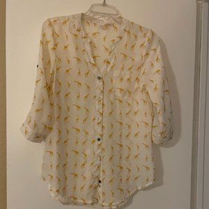 White shirt with little goldish yellow giraffes all over it, ladies medium